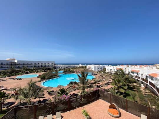 aerial view of swimming pool near body of water during daytime in Sal Cape Verde