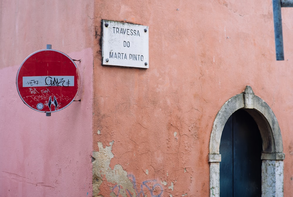 no smoking sign on red concrete wall