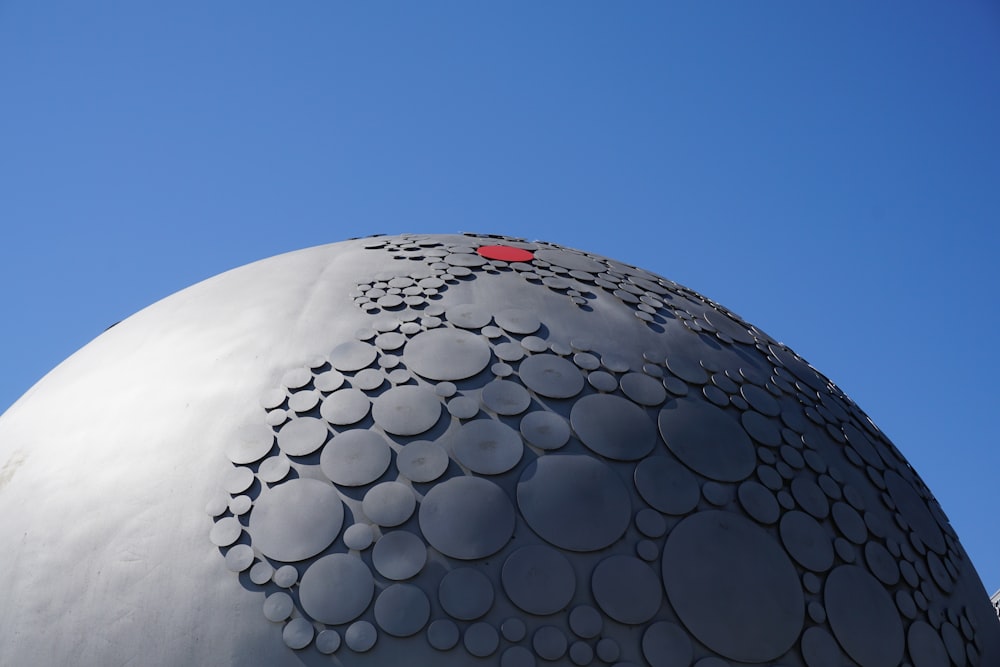 white round concrete structure under blue sky during daytime
