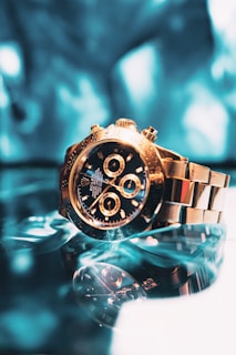 gold and silver chronograph watch