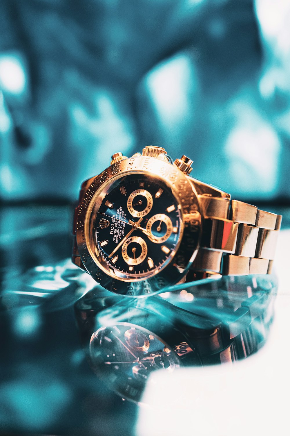 gold and silver chronograph watch