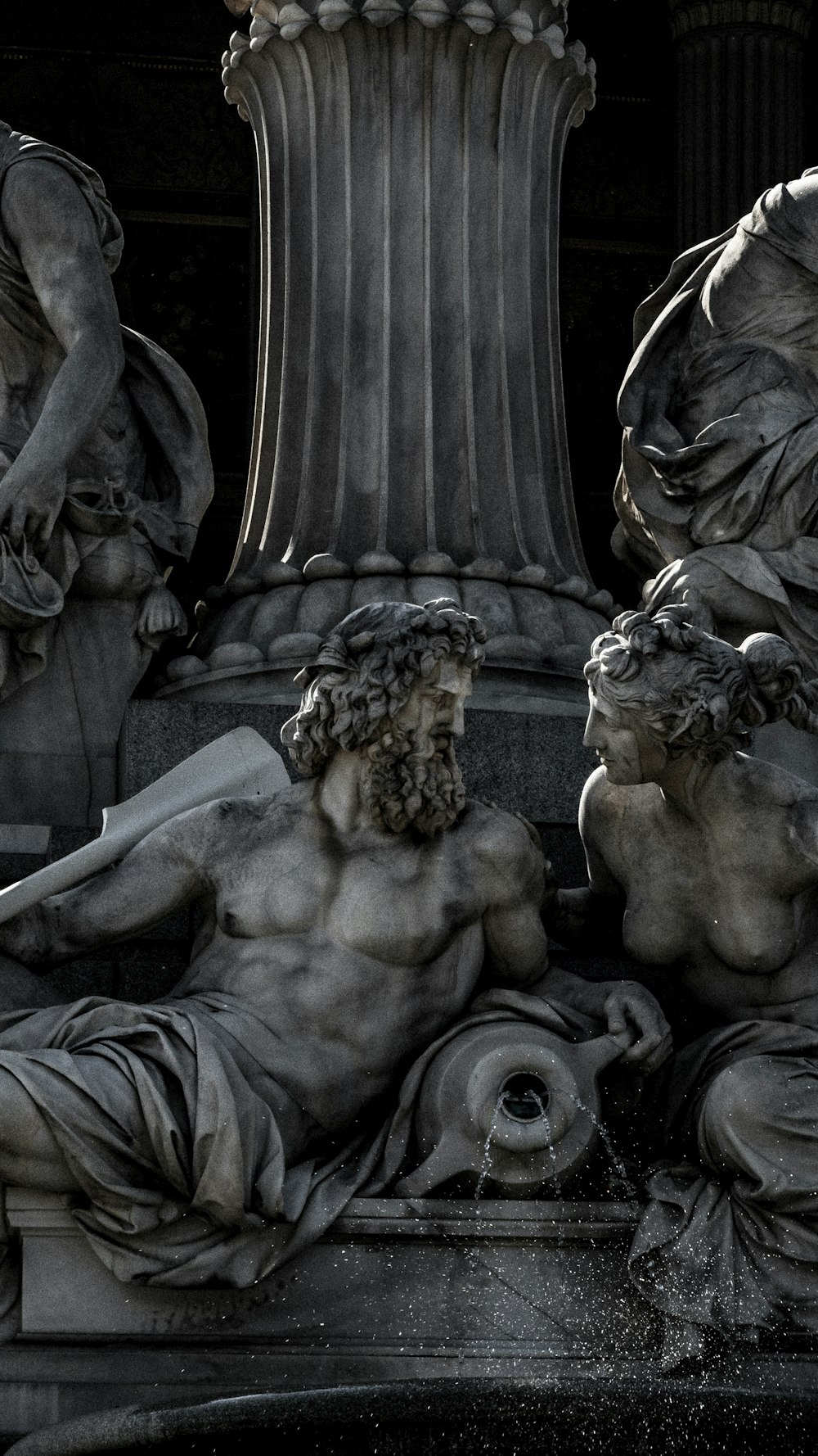 gray concrete statue of man and woman