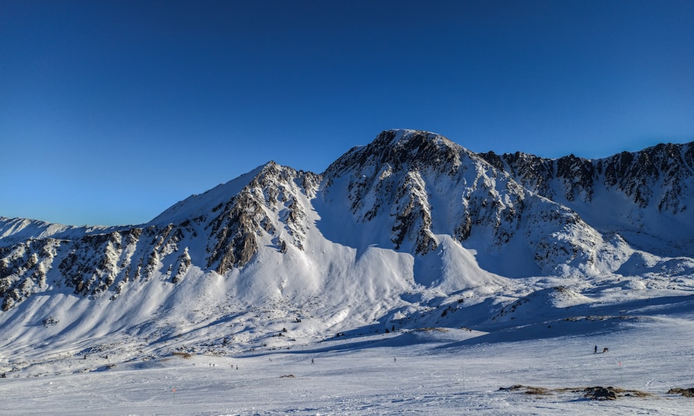 snow covered mountain under blue sky during daytime