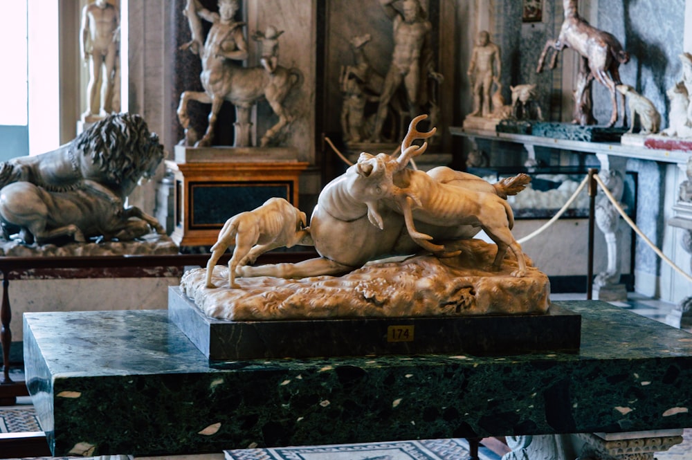 brown horse statue on black concrete table