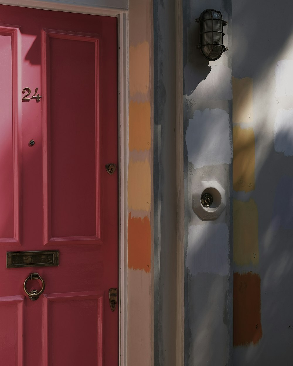 red wooden door with silver door knob