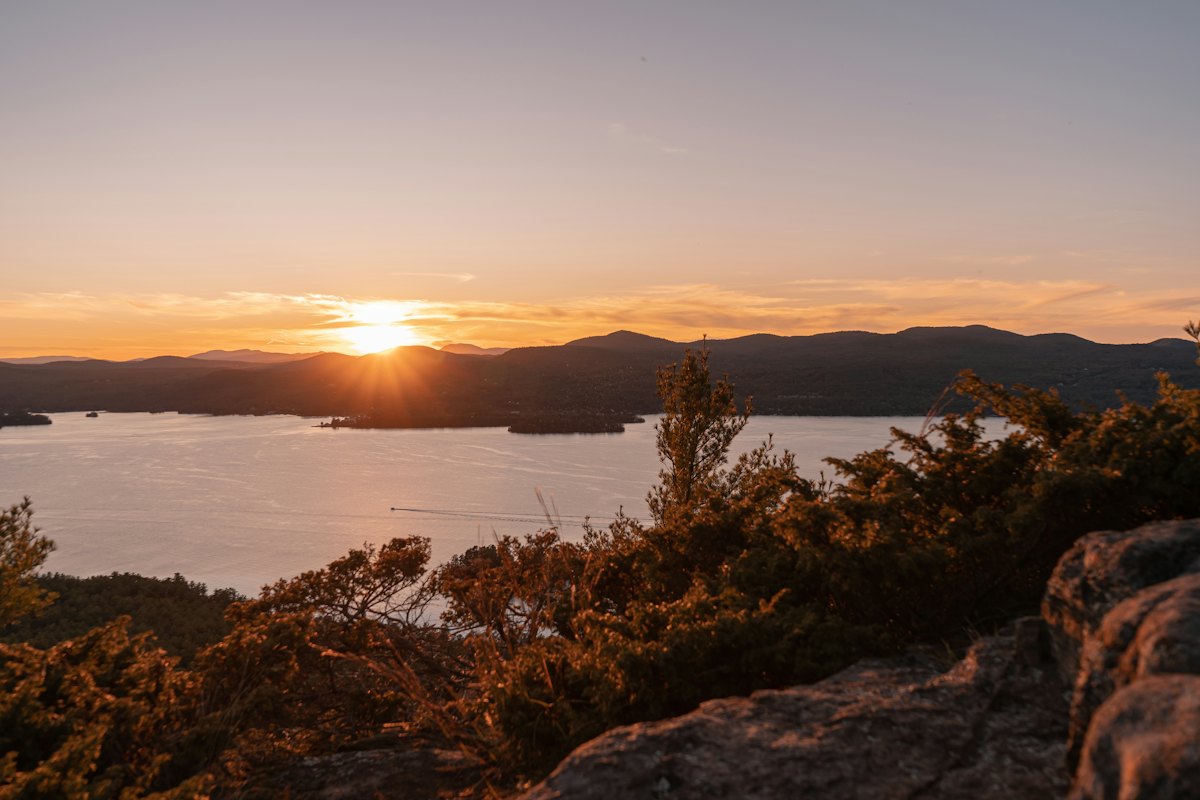 Sunset over Lake George and its islands from a rocky summit