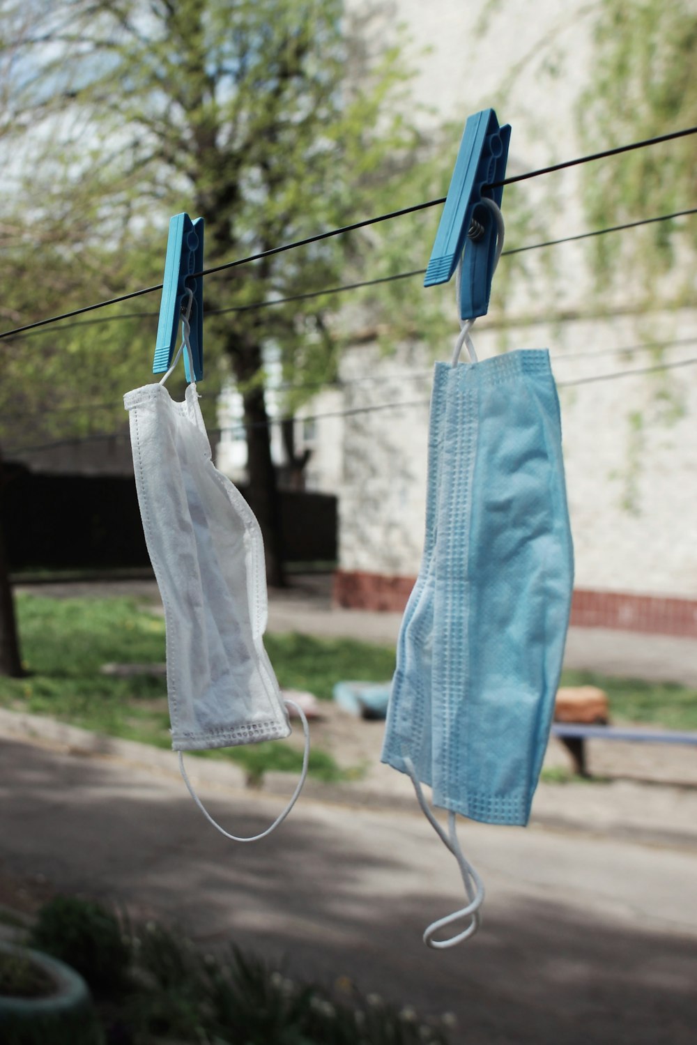 blue denim jeans hanged on clothes hanger