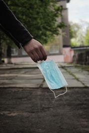 person holding blue plastic pack