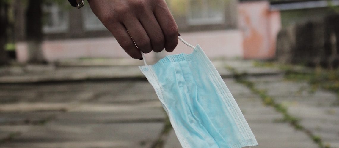 person holding blue plastic pack
