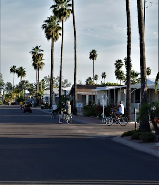 Golf carts in a gated community setting with residents enjoying a ride