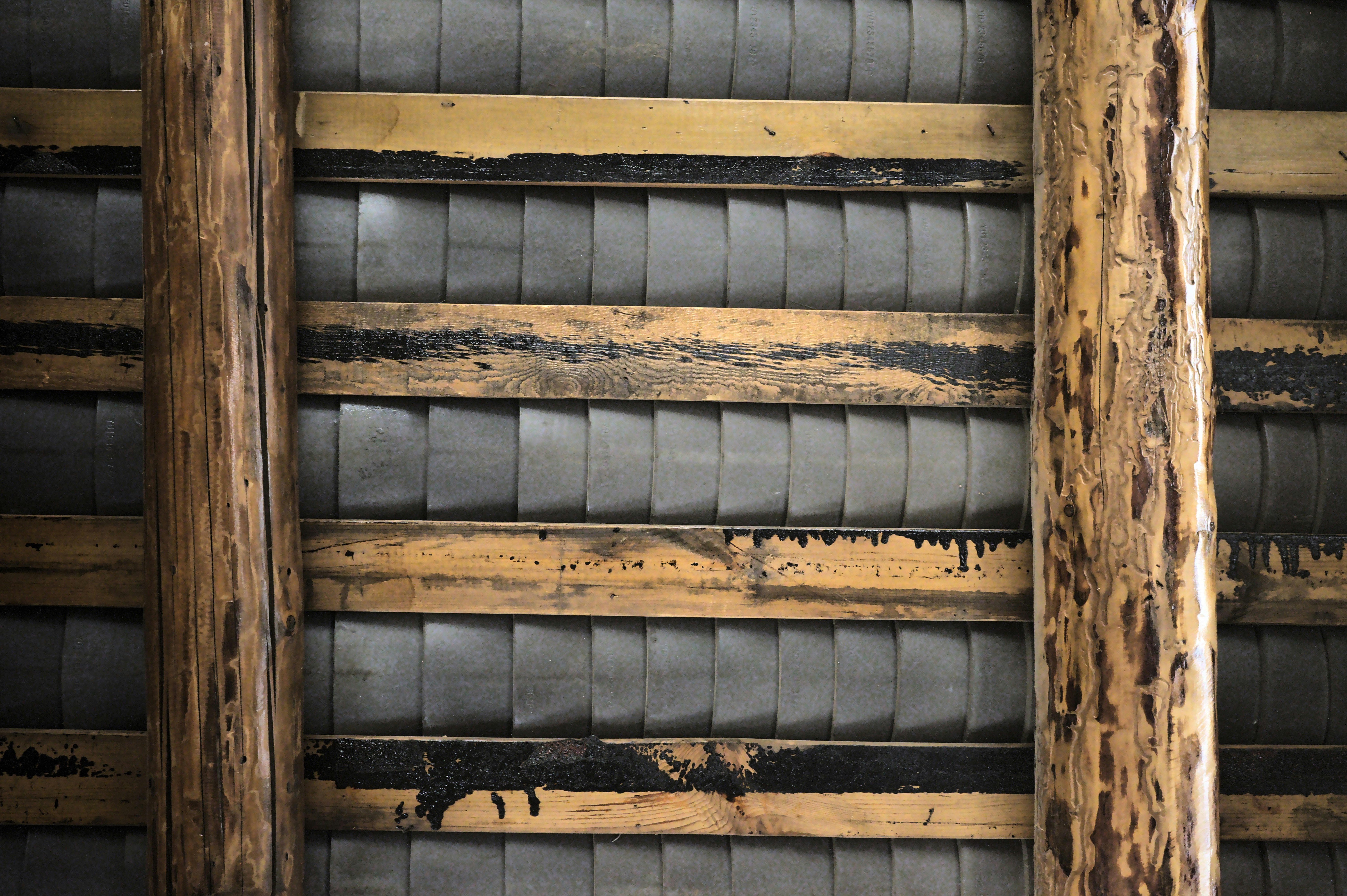 brown wooden frame with blue and white striped textile