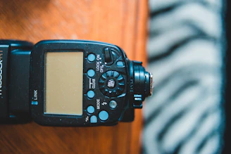 Close-up of the Flash Bar Pro's sleek, compact design resting on a wooden bar counter.