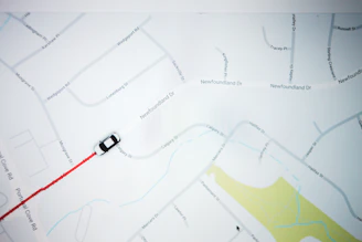Map overlay showing parcel boundaries with highlighted plot and nearby roads.