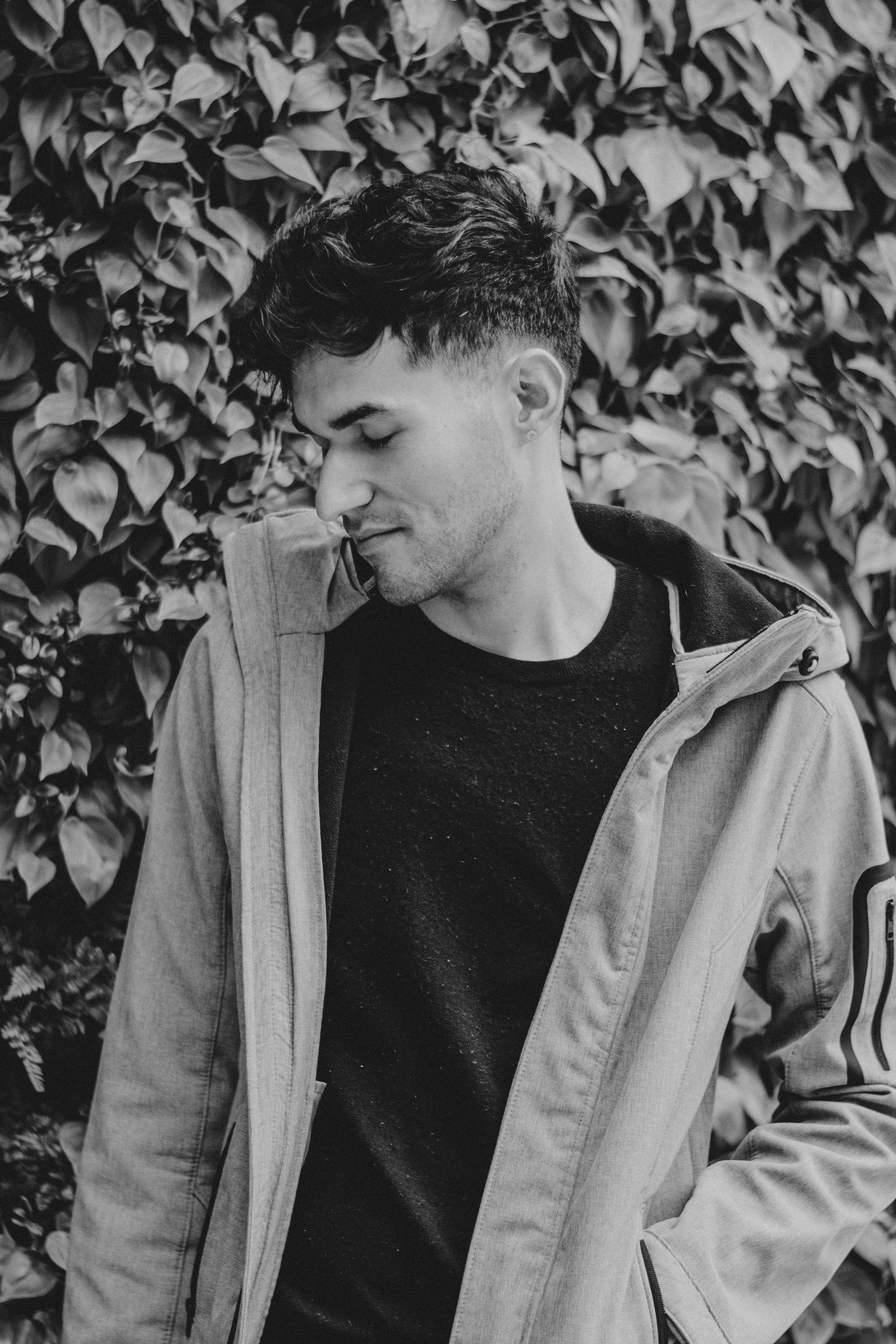 man in black crew neck shirt and beige coat