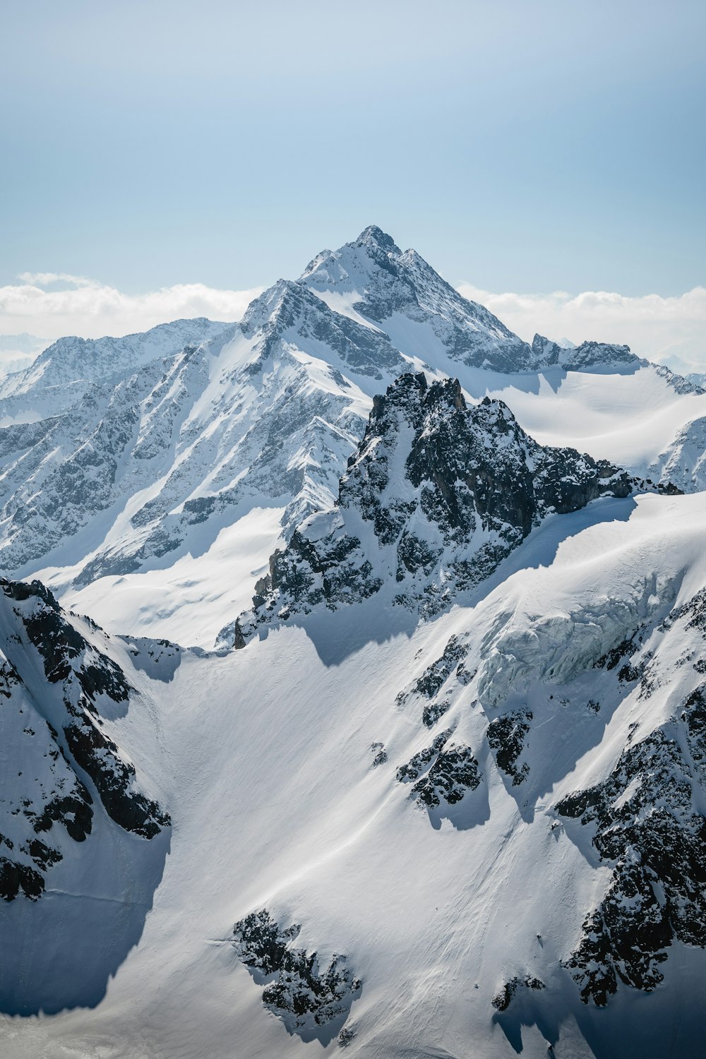 snow covered mountain during daytime