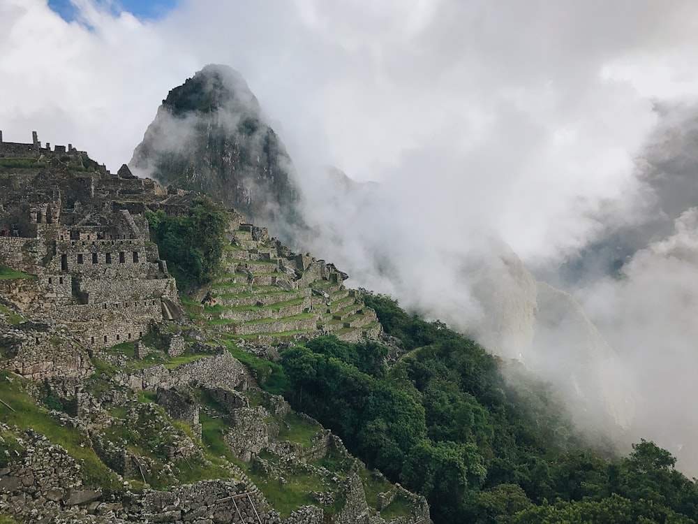 green mountain under white clouds during daytime