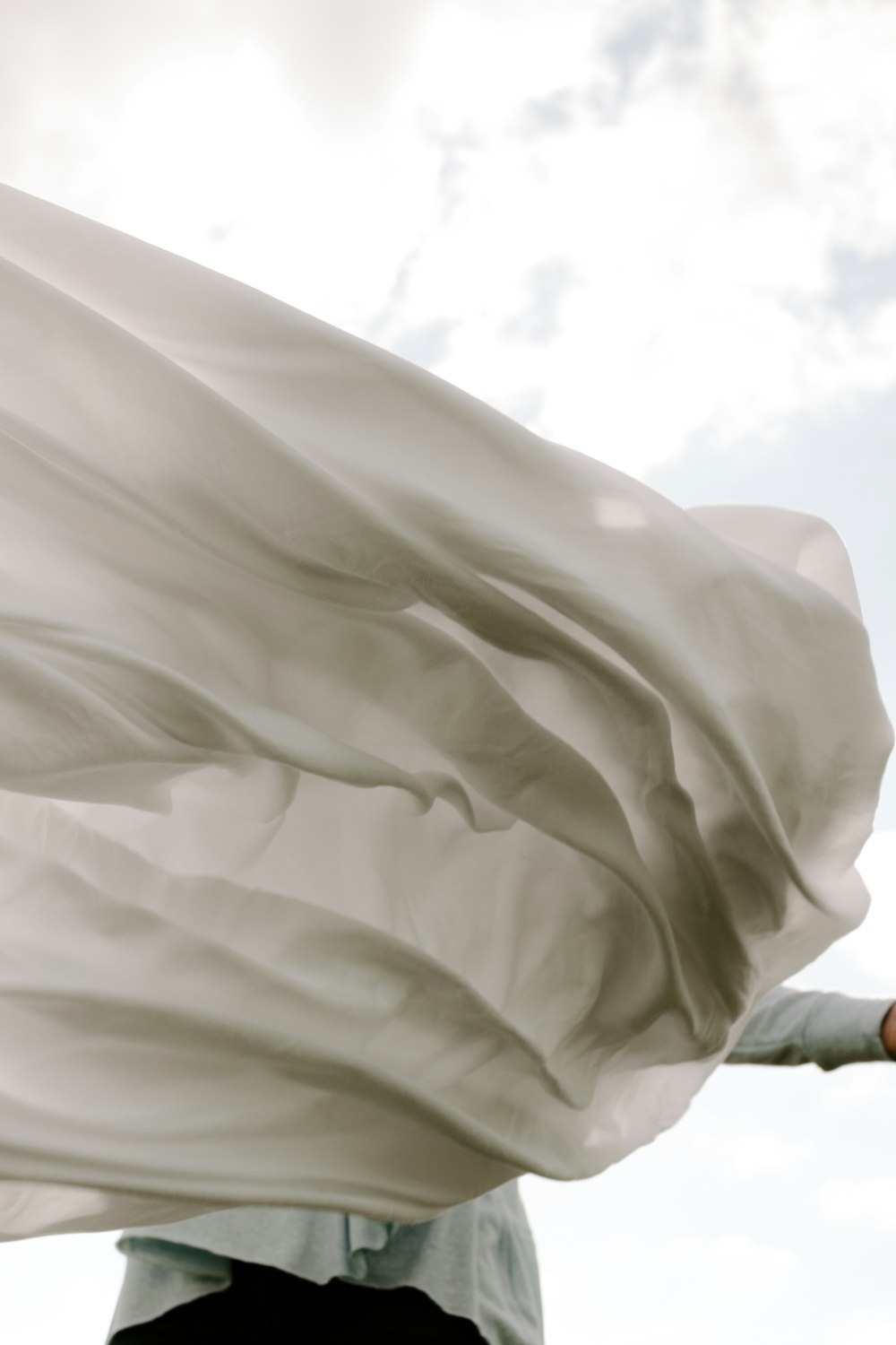 a man holding a white cloth in his hand