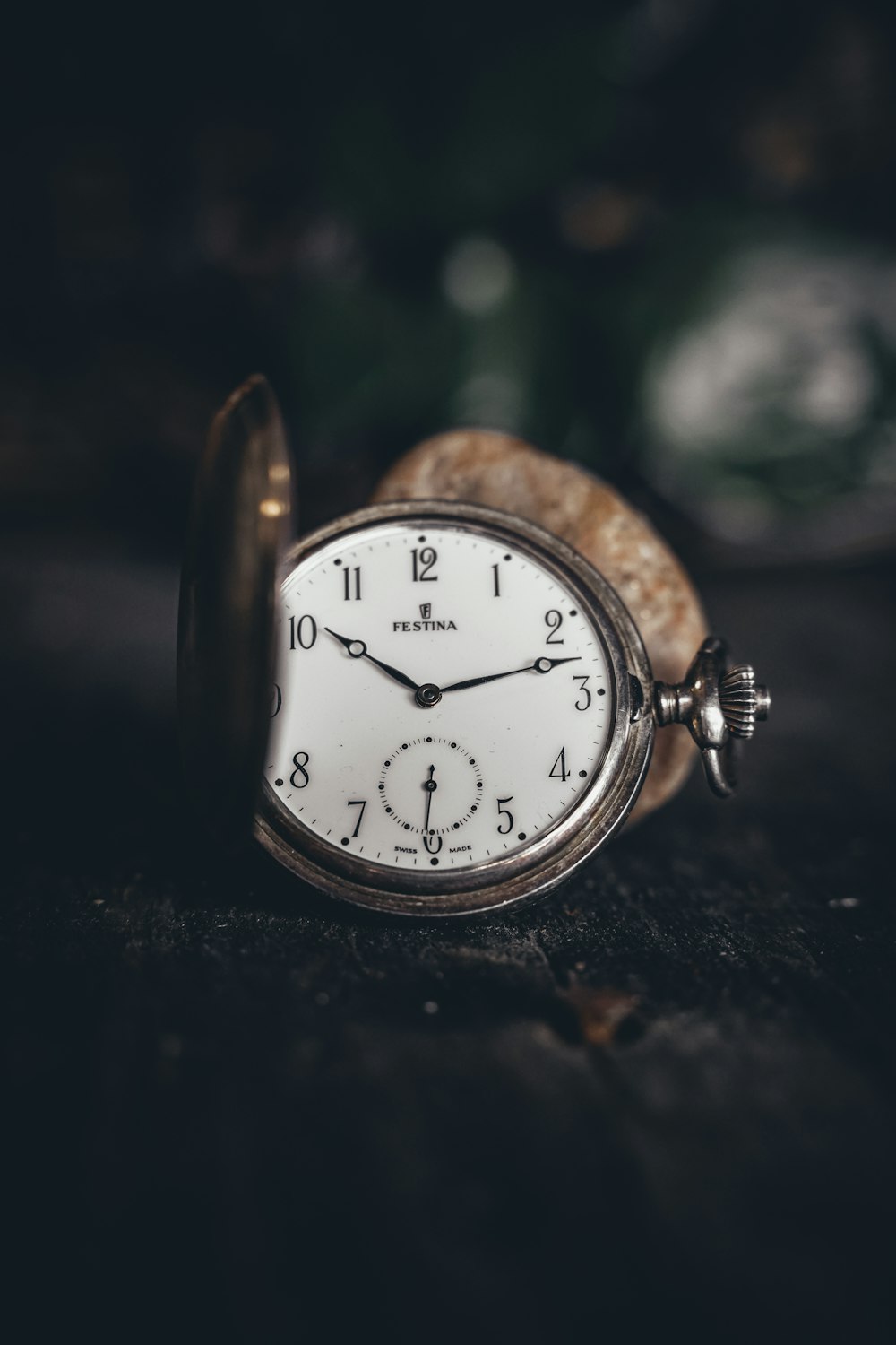 silver and white analog alarm clock