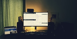 Office workspace with charts and digital interface showing process optimization.