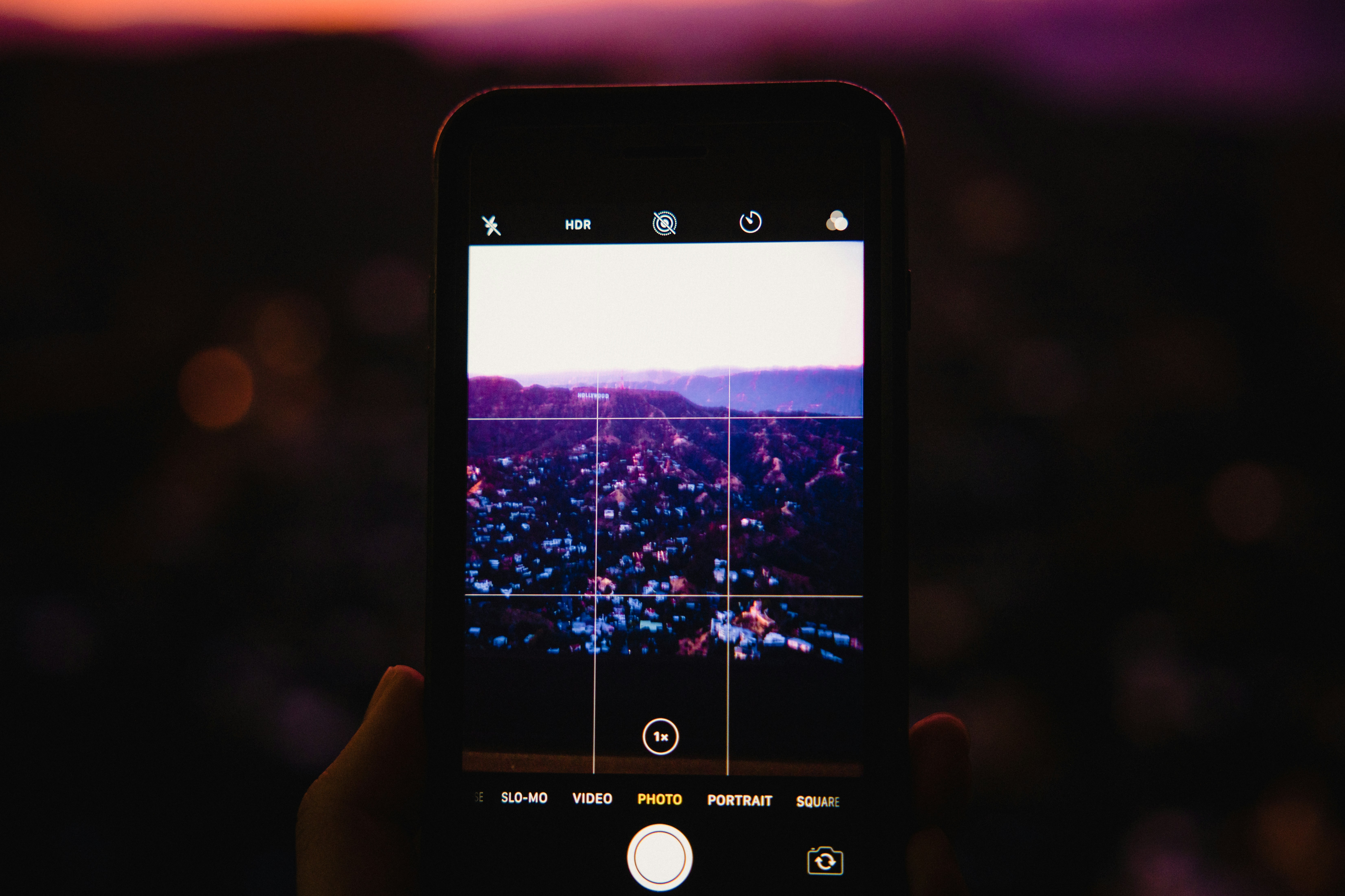 person holding iphone displaying map