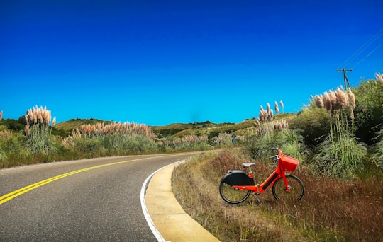 red and black motorcycle on road during daytime in Córdoba Argentina