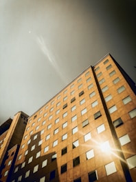 brown concrete building under blue sky