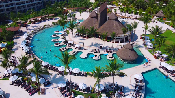 aerial view of swimming pool near beach during daytime