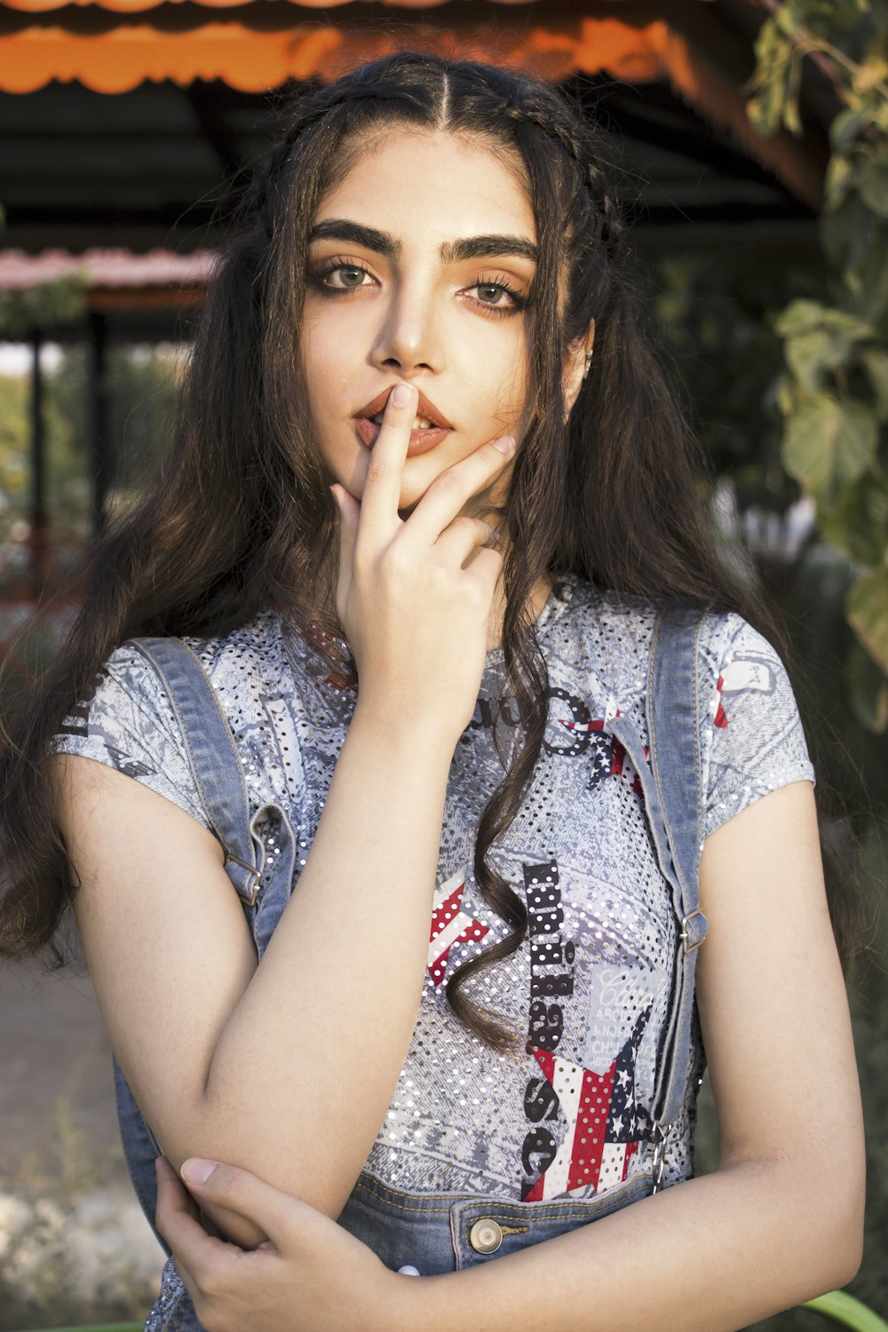 woman in gray and white floral shirt