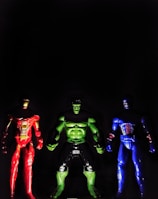 Professional image of premium action figures lined up against a dark blue backdrop.