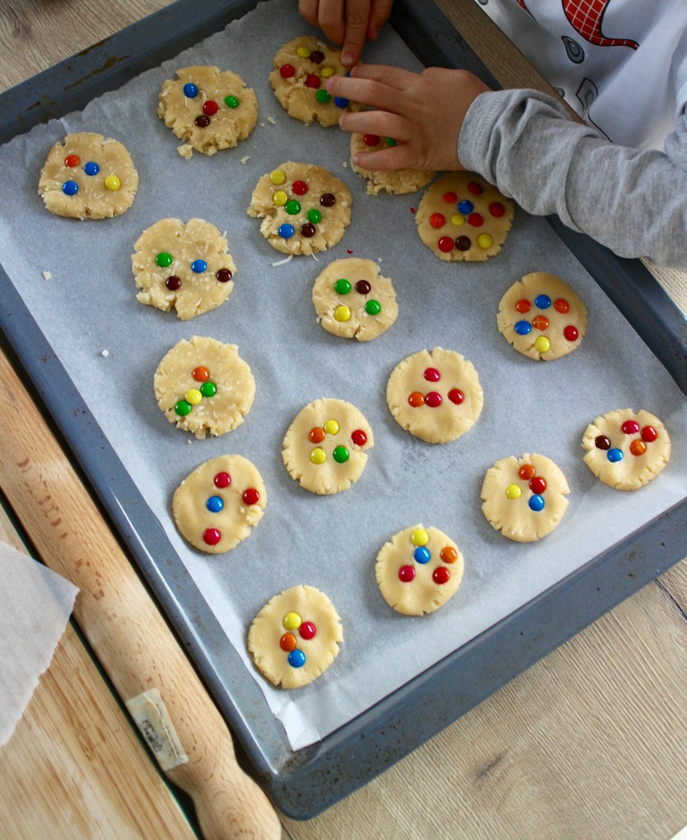 white and yellow round cookies on white tray