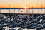 Sunset view over a marina filled with connected yachts and sailboats