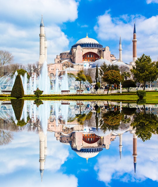 brown and white concrete building near body of water during daytime in Hagia Sophia Museum Turkey