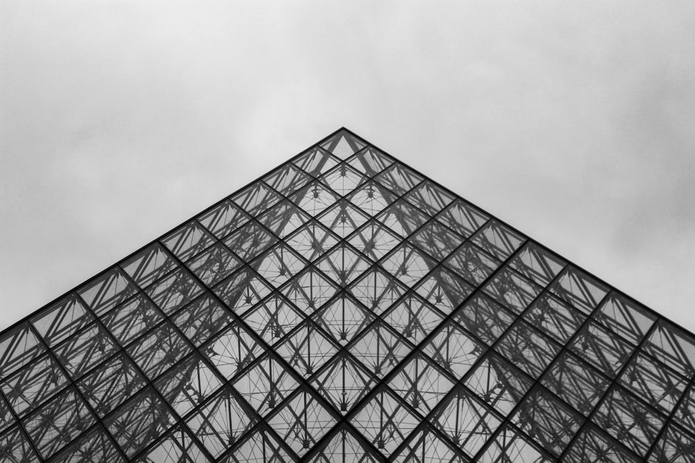 grayscale photo of glass building