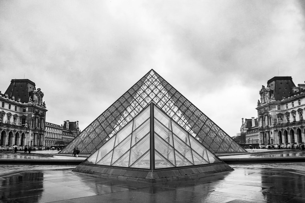 grayscale photo of pyramid building