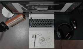 black and silver computer keyboard on white table