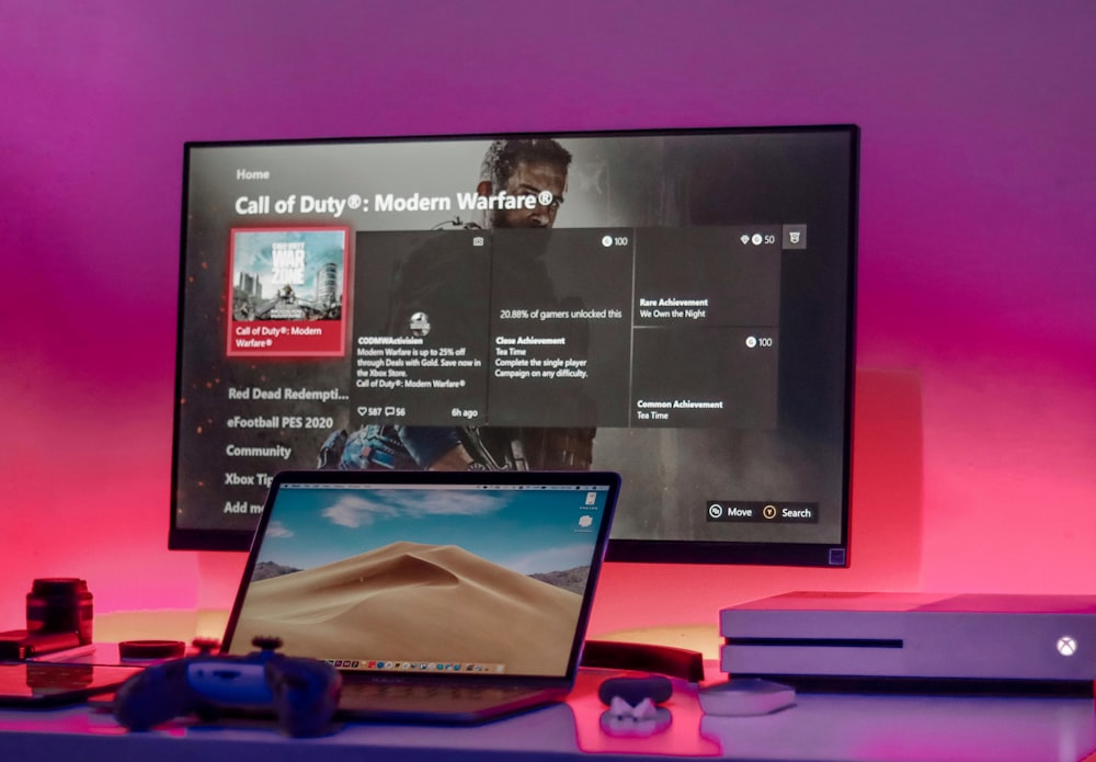 a laptop computer sitting on top of a desk