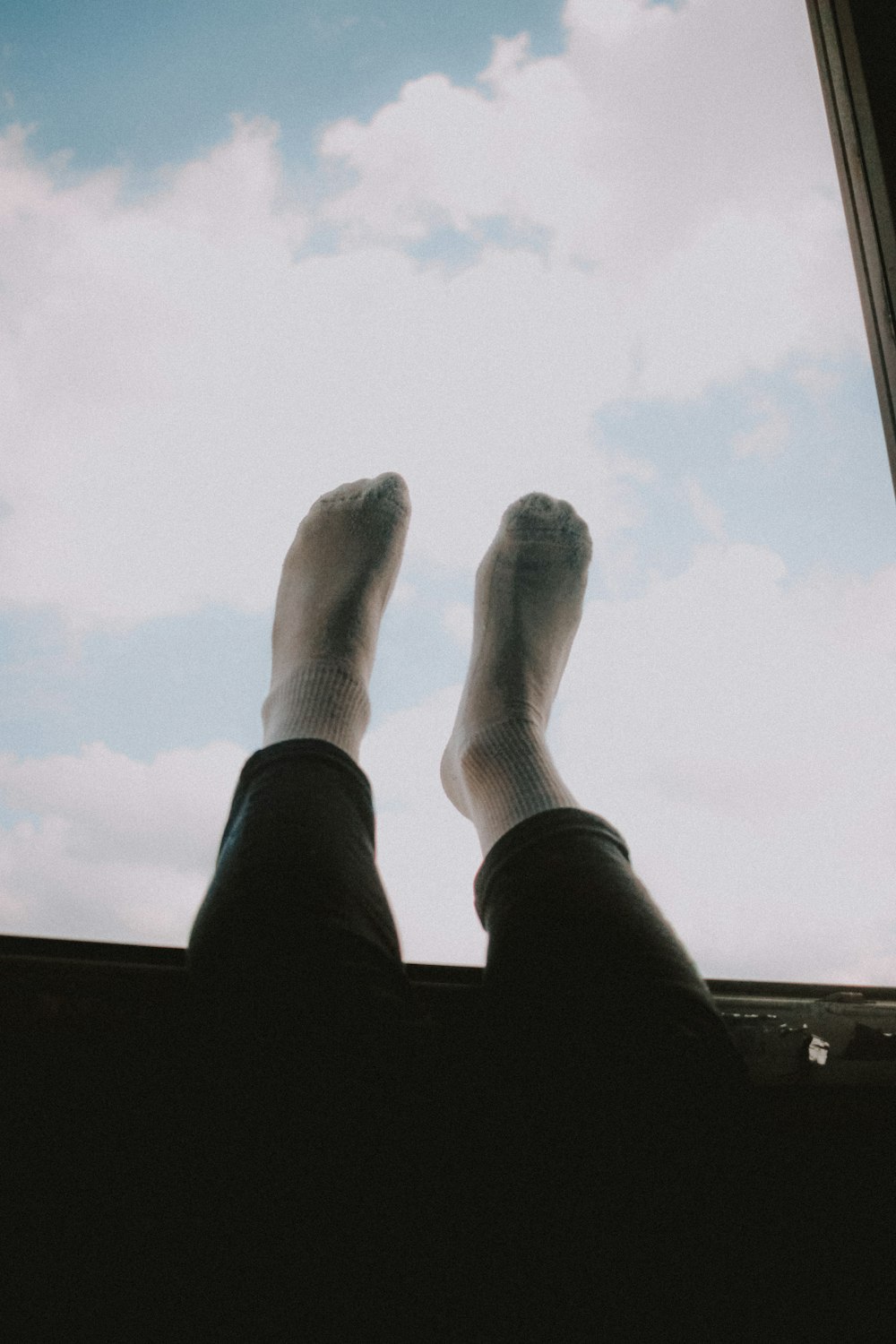 person in black pants and white socks