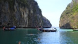 A quiet moment at a cliffside viewpoint overlooking the turquoise waters near Phi Phi islands.