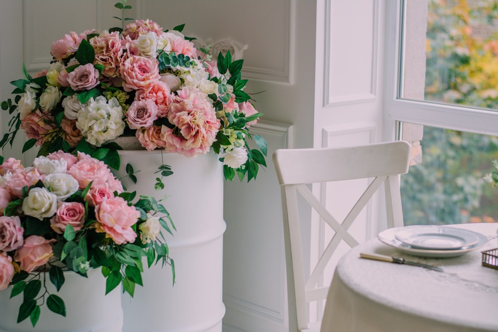 pink and white flowers on white table