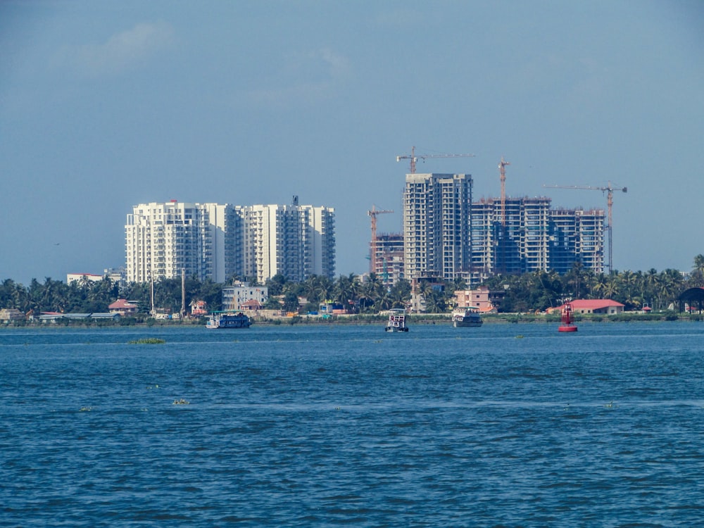 city skyline across body of water during daytime