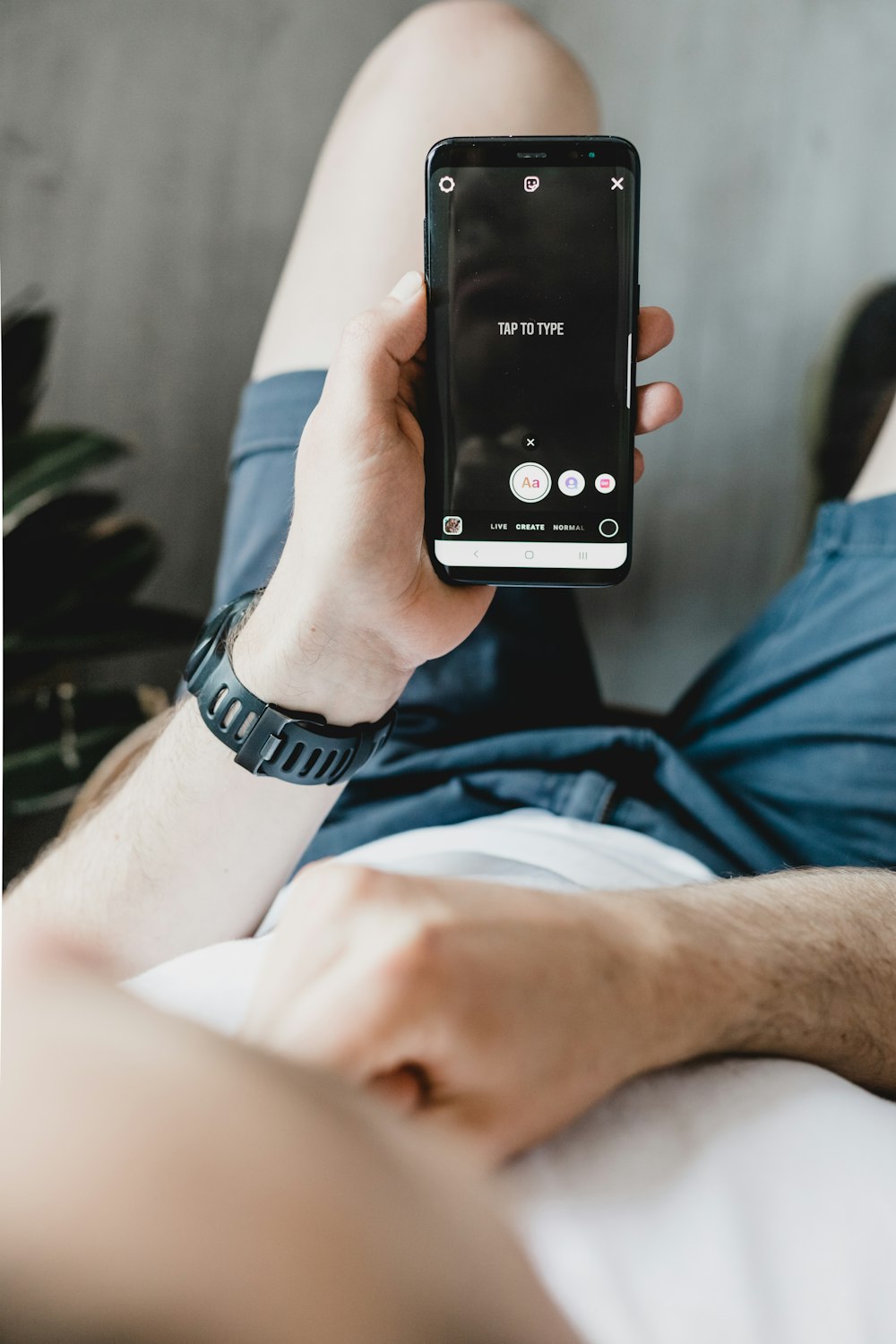 person holding black android smartphone