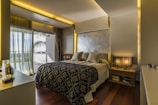 Master bedroom with king-size bed and blackout curtains for restful sleep.