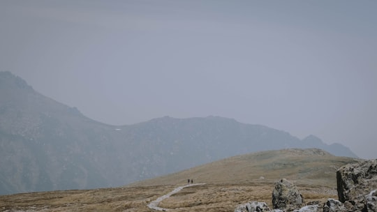 gray road in the middle of the mountains in Kosciuszko National Park NSW Australia