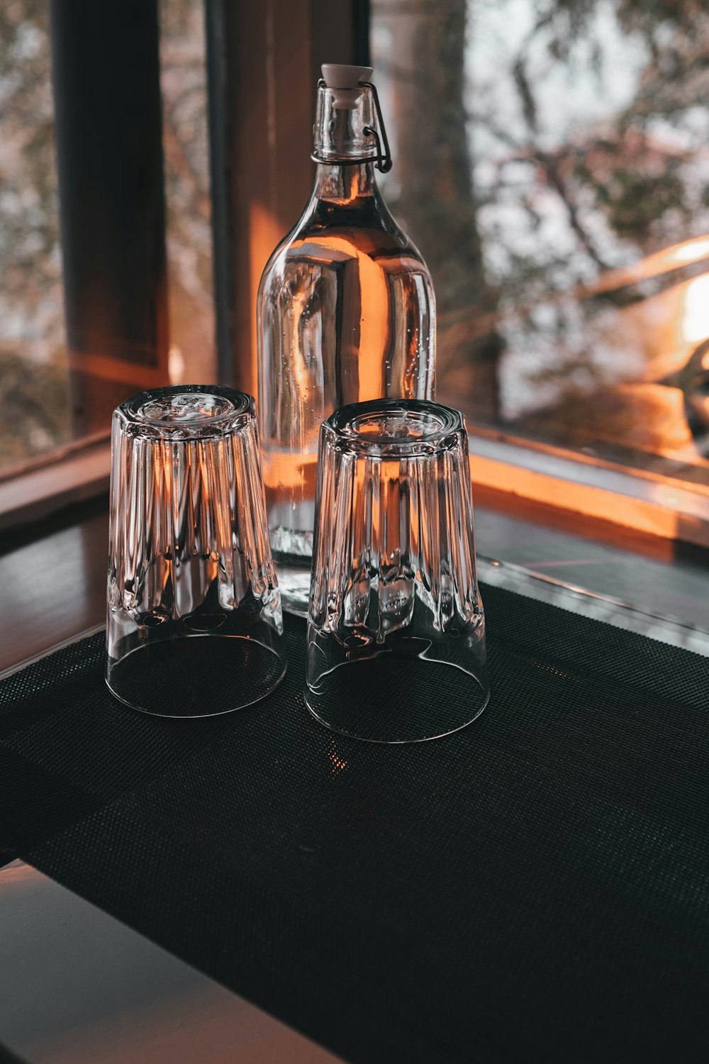 clear drinking glass on black table