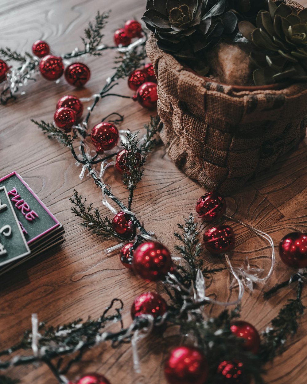 red and silver baubles on brown wooden table