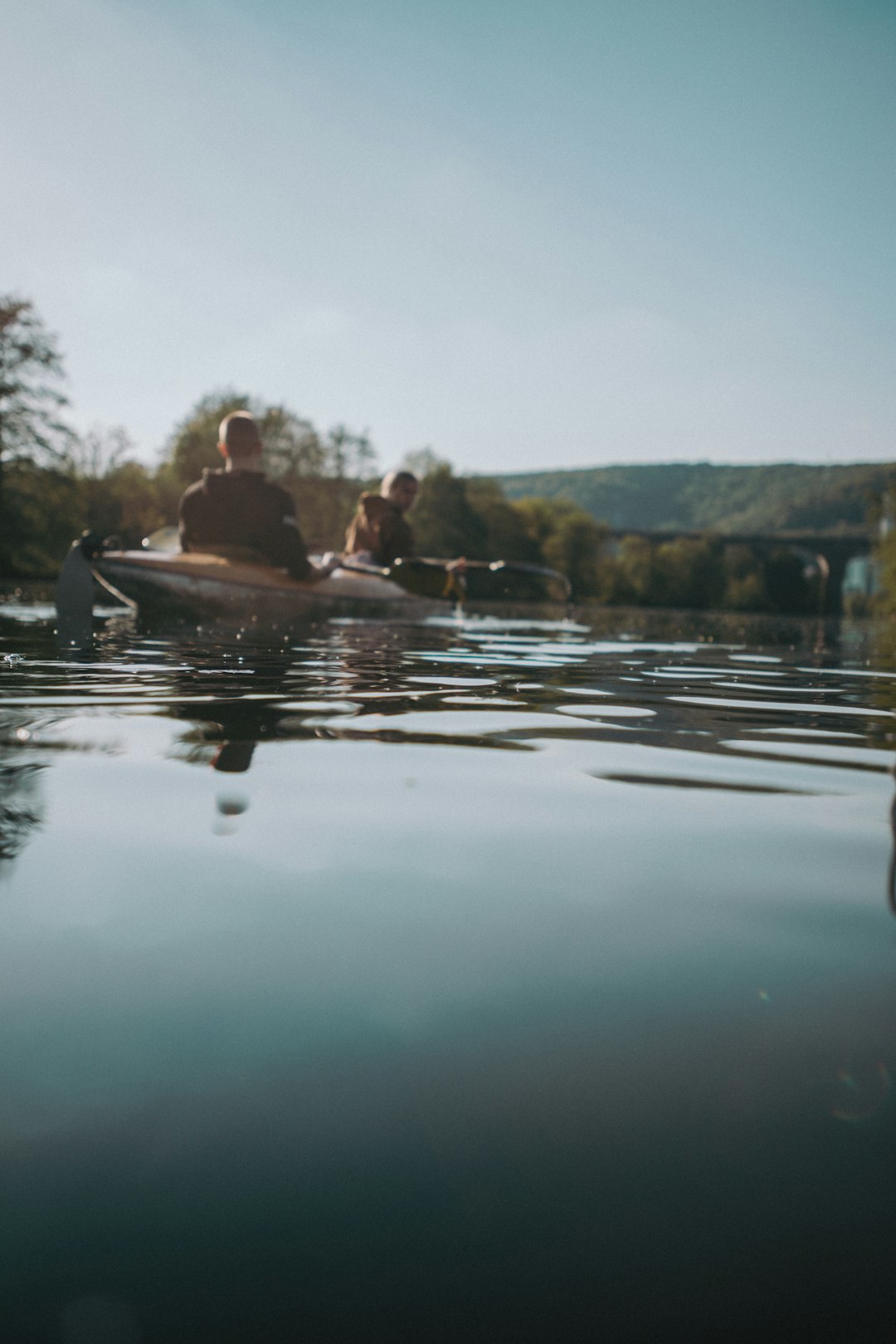 2 men riding on boat during daytime