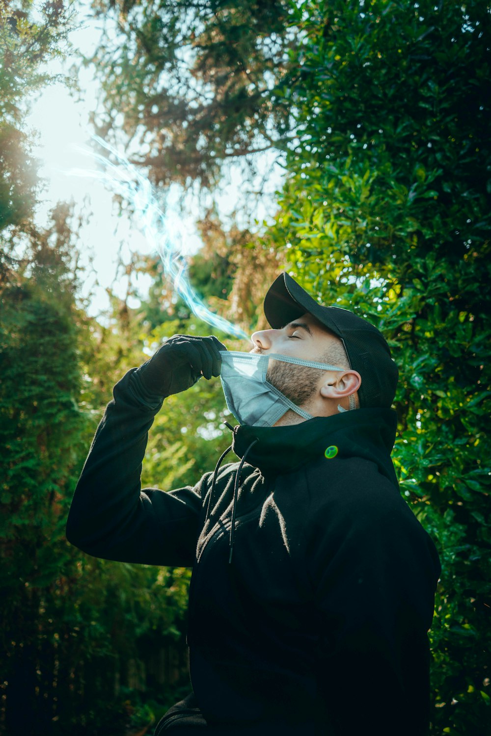 man in black jacket smoking