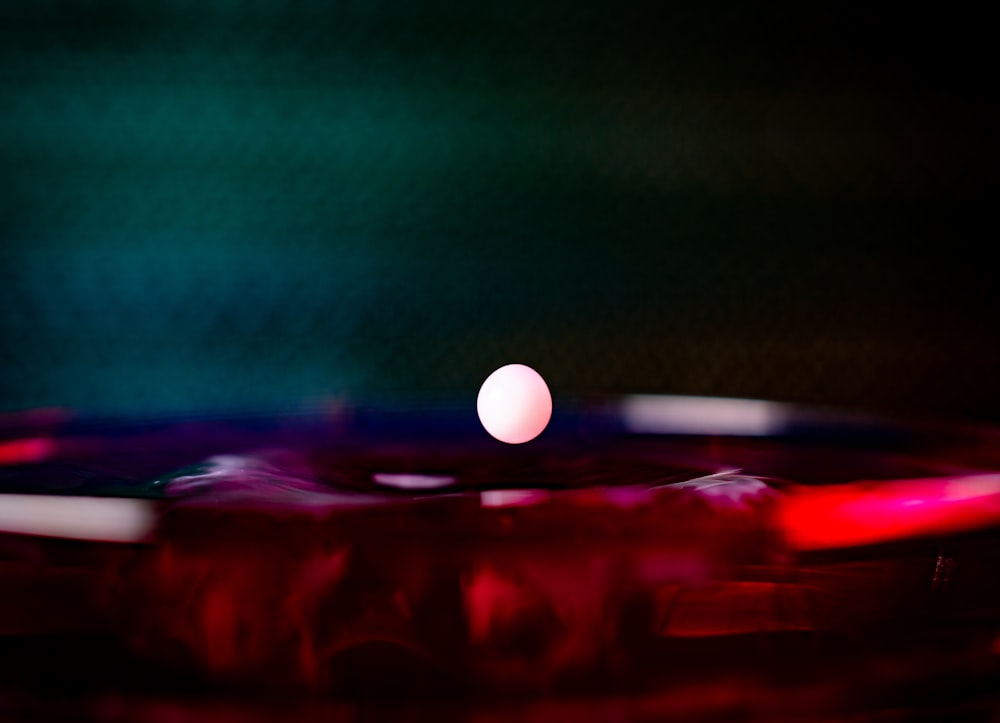 white ball on red surface