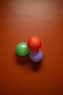 2 white and pink egg on brown wooden table