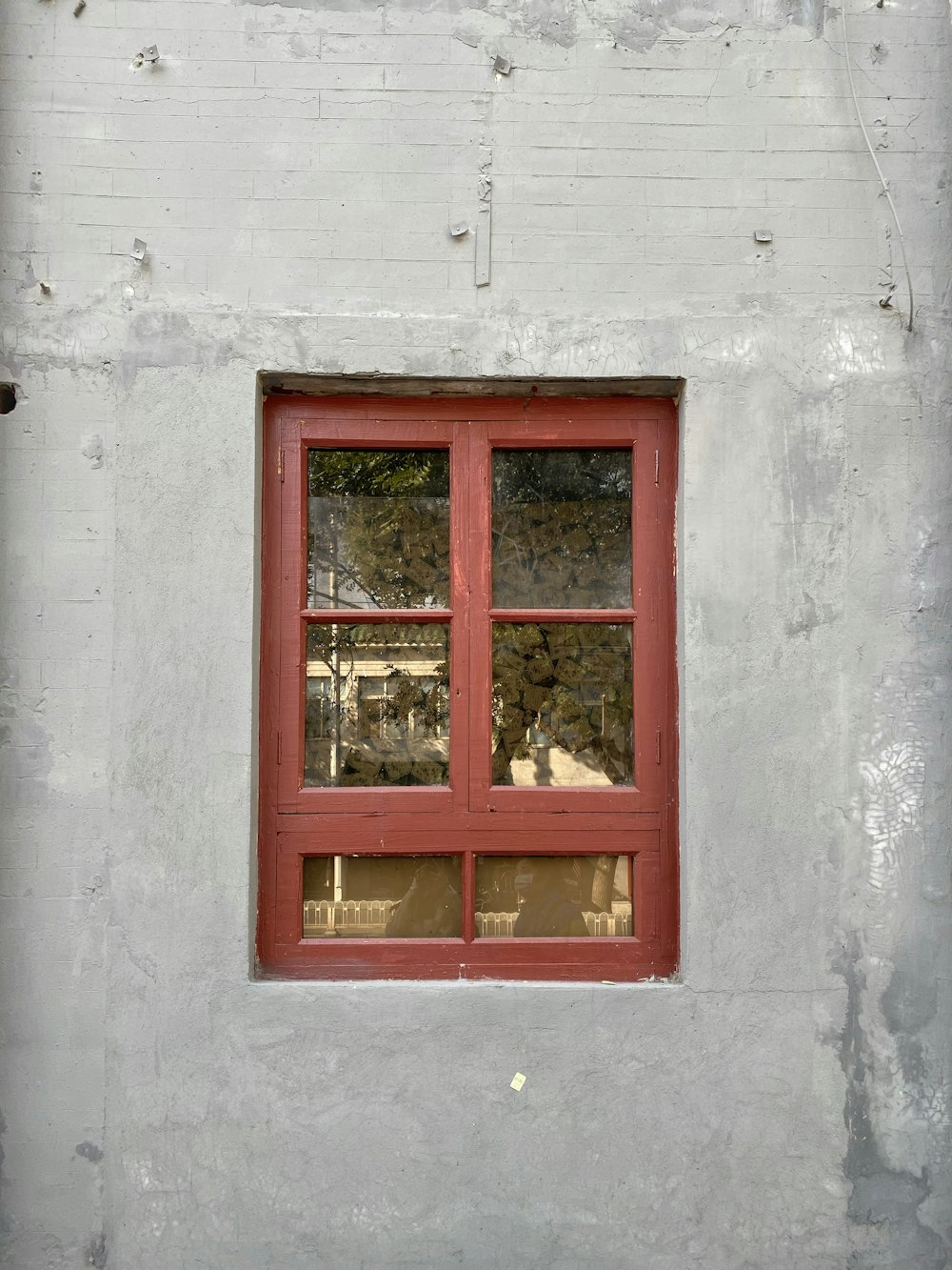 red wooden framed glass window